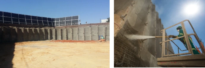 Worker inspecting trench shoring and braces in a deep excavation