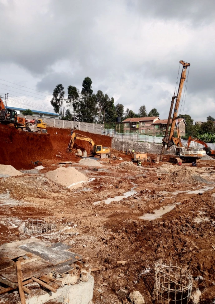 Illustration of a basement cross-section for Kiambu Road showing deep foundations supporting a two-story home.
