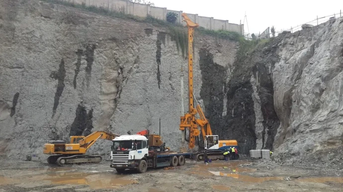  A crane installing piles near Upper Hill, Nairobi, with a caption about stabilizing foundations for long-term safety.