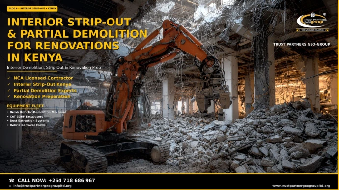 Interior strip-out and partial demolition for renovations in Kenya — an orange robotic demolition excavator working inside a stripped commercial building interior surrounded by concrete rubble, debris piles, and exposed rebar hanging from the ceiling slab. Trust Partners Geo Group, NCA licensed contractor for interior demolition, strip-out, and renovation preparation with dust control. Call +254 718 686 967