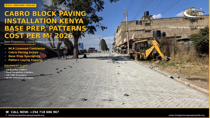 Cabro block paving installation in Kenya — a wide urban road freshly paved with grey cabro blocks in herringbone pattern, loose blocks scattered along the carriageway awaiting placement, a yellow JCB backhoe loader parked on the verge, with a flyover, stone buildings, and power lines in the background. Trust Partners Geo Group, NCA licensed contractor for base preparation, paving patterns, and per-m² cost guidance. Call +254 718 686 967